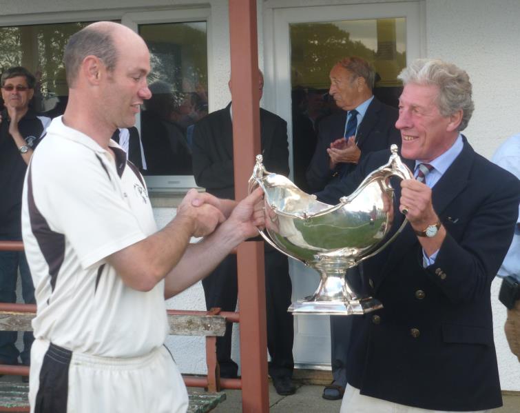 Gregg Miller receives the bowl from Hugh Harrison-Allen Gregg Miller receives the bowl from Hugh Harrison-Allen